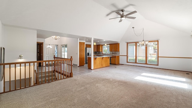 1220 E Brierwood Dr, Spokane, WA 99218 - unfurnished living room featuring a chandelier, light colored carpet, high vaulted ceiling, and a ceiling fan