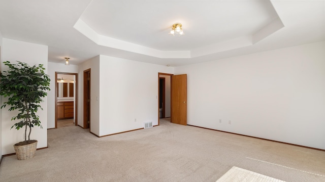 1220 E Brierwood Dr, Spokane, WA 99218 - unfurnished room featuring a raised ceiling and light colored carpet