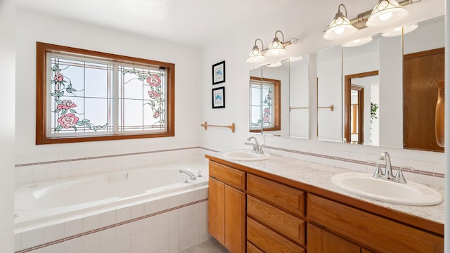 1220 E Brierwood Dr, Spokane, WA 99218 - full bathroom featuring plenty of natural light, double vanity, a bath, and decorative backsplash