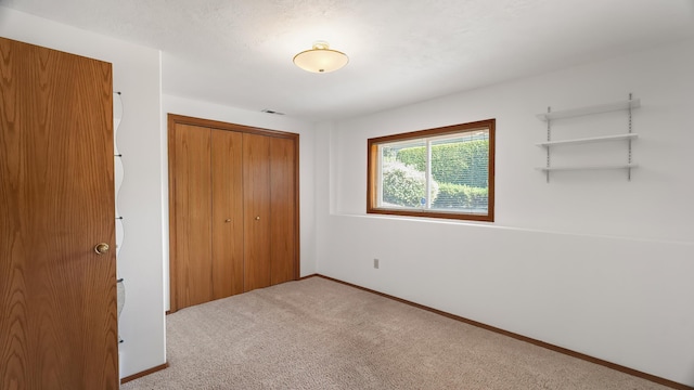 1220 E Brierwood Dr, Spokane, WA 99218 - unfurnished bedroom with a closet and carpet
