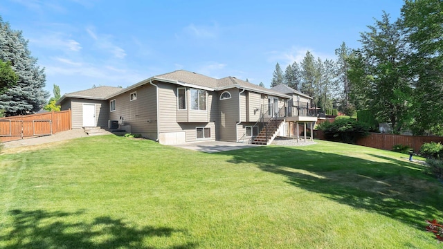 1220 E Brierwood Dr, Spokane, WA 99218 - back of property featuring stairs, a wooden deck, and a patio