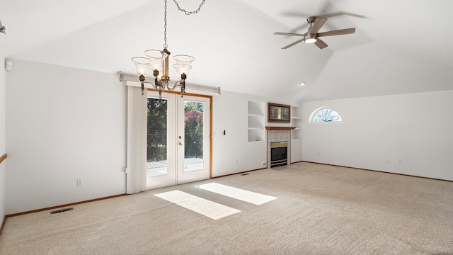 1220 E Brierwood Dr, Spokane, WA 99218 - unfurnished living room featuring lofted ceiling, carpet flooring, a ceiling fan, a chandelier, and a tiled fireplace