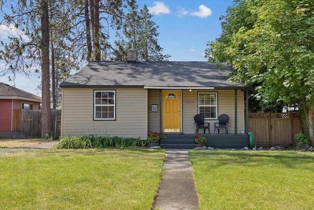4303 W Crown Ave, Spokane, WA 99205 - bungalow-style house featuring covered porch, a chimney, and a shingled roof