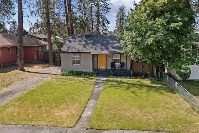 4303 W Crown Ave, Spokane, WA 99205 - view of front of house featuring a porch and a chimney