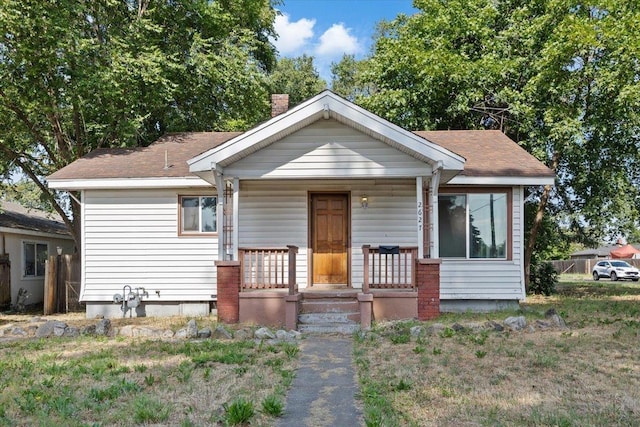 2627 N Altamont St, Spokane, WA 99207 - bungalow-style house with a porch, a chimney, and roof with shingles