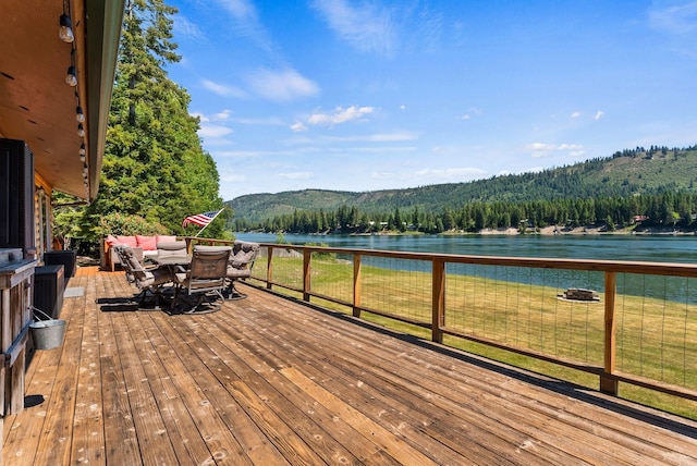 161 S Alaska Ln, Cusick, WA 99119 - wooden deck with a water view, a forest view, and outdoor dining space