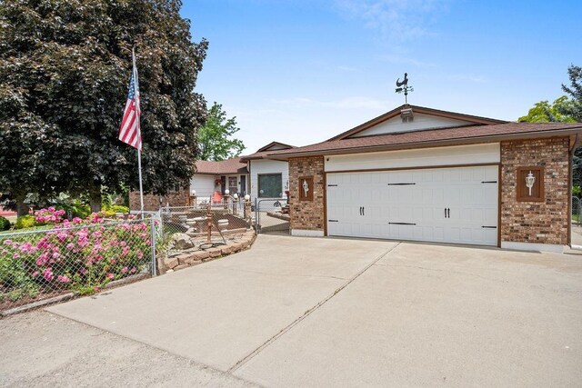 4821 S Conklin Rd, Greenacres, WA 99016 - ranch-style home with brick siding, concrete driveway, and a garage