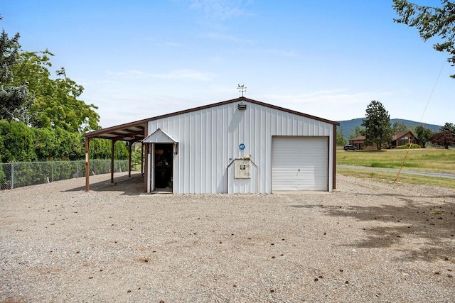 4821 S Conklin Rd, Greenacres, WA 99016 - garage with a garage, driveway, and a mountain view