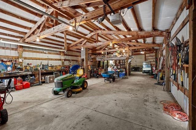 4821 S Conklin Rd, Greenacres, WA 99016 - garage featuring a garage door opener and a workshop area