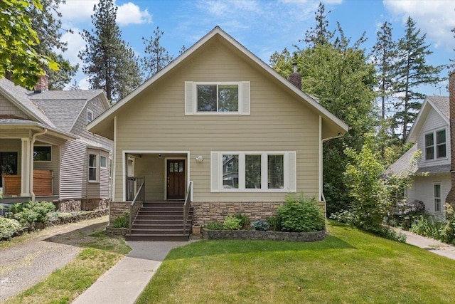 1007 W 15th Ave, Spokane, WA 99203 - view of front of home with a front lawn, stone siding, and a chimney