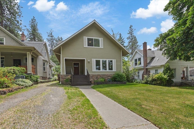 1007 W 15th Ave, Spokane, WA 99203 - view of front of house featuring stone siding and a front lawn