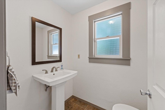 1007 W 15th Ave, Spokane, WA 99203 - half bath featuring toilet and baseboards