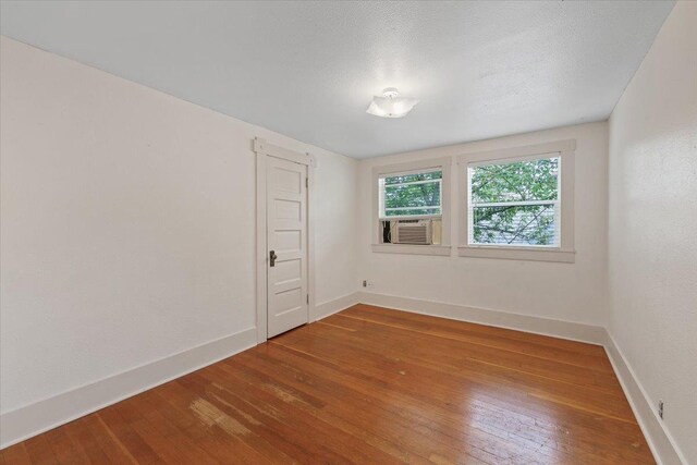 1007 W 15th Ave, Spokane, WA 99203 - empty room featuring cooling unit and wood-type flooring