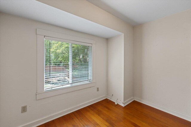 1007 W 15th Ave, Spokane, WA 99203 - spare room with wood finished floors and baseboards