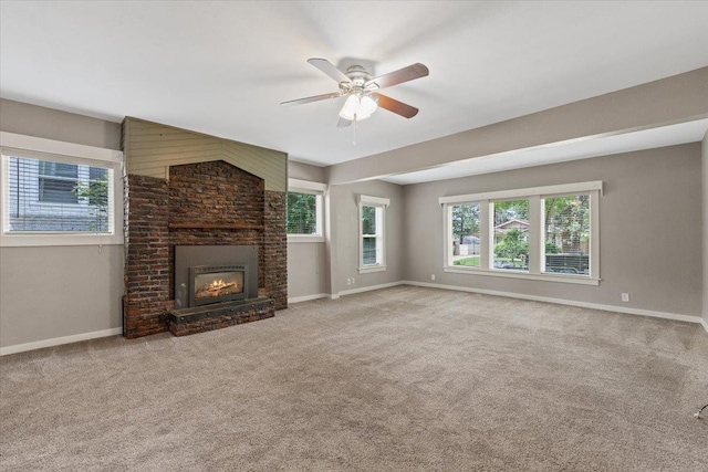 1007 W 15th Ave, Spokane, WA 99203 - unfurnished living room featuring carpet floors, a fireplace, and a ceiling fan