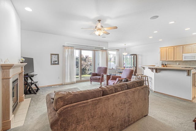 2526 E 62nd Ln, Spokane, WA 99223 - living area featuring light carpet, a ceiling fan, recessed lighting, and a tile fireplace