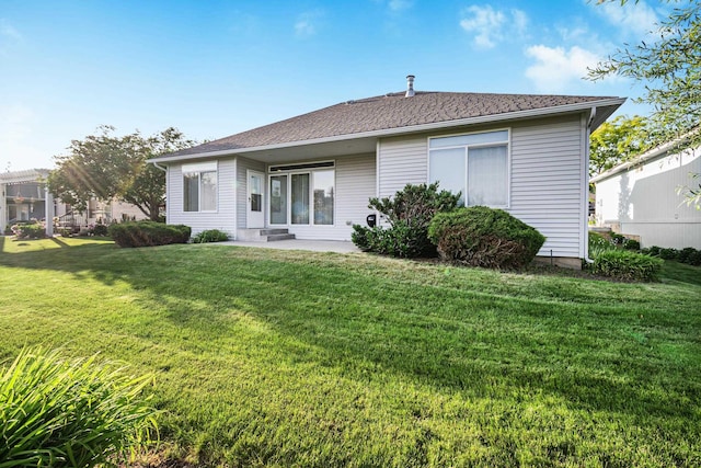2526 E 62nd Ln, Spokane, WA 99223 - back of house with a lawn