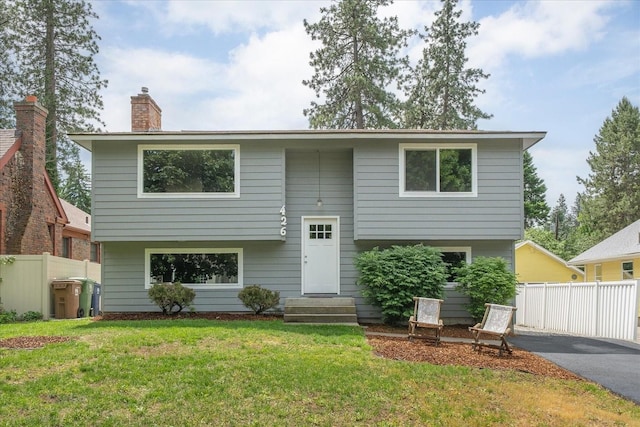 426 E 17th St, Spokane, WA 99203 - bi-level home with entry steps, a chimney, and driveway