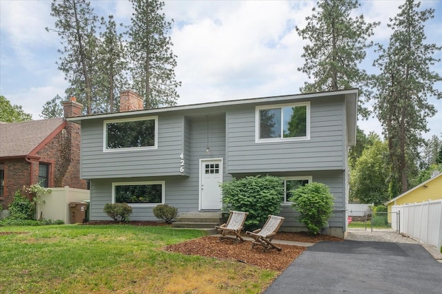 426 E 17th St, Spokane, WA 99203 - bi-level home featuring a chimney and asphalt driveway