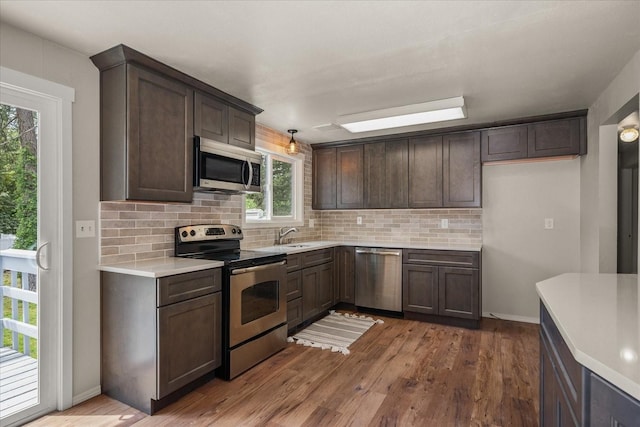 426 E 17th St, Spokane, WA 99203 - kitchen featuring stainless steel appliances, tasteful backsplash, plenty of natural light, and light countertops