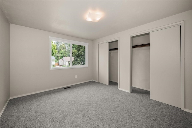 426 E 17th St, Spokane, WA 99203 - unfurnished bedroom with two closets and carpet floors