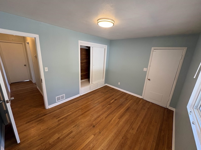 820/828 W 11th Ave, Spokane, WA 99204 - unfurnished bedroom with a closet and wood finished floors
