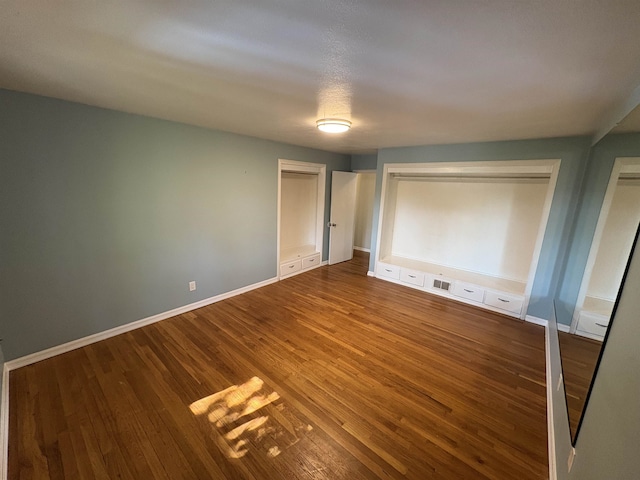 820/828 W 11th Ave, Spokane, WA 99204 - unfurnished bedroom with wood finished floors and baseboards
