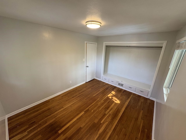820/828 W 11th Ave, Spokane, WA 99204 - unfurnished bedroom featuring dark wood finished floors and a closet