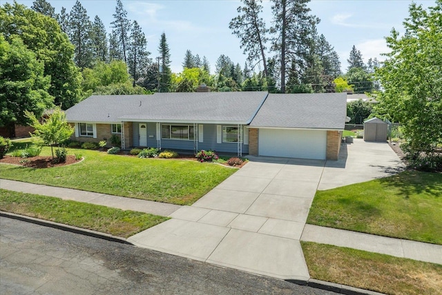 915 W 32nd Ave, Spokane, WA 99203 - ranch-style house featuring brick siding, concrete driveway, a garage, a front lawn, and a chimney
