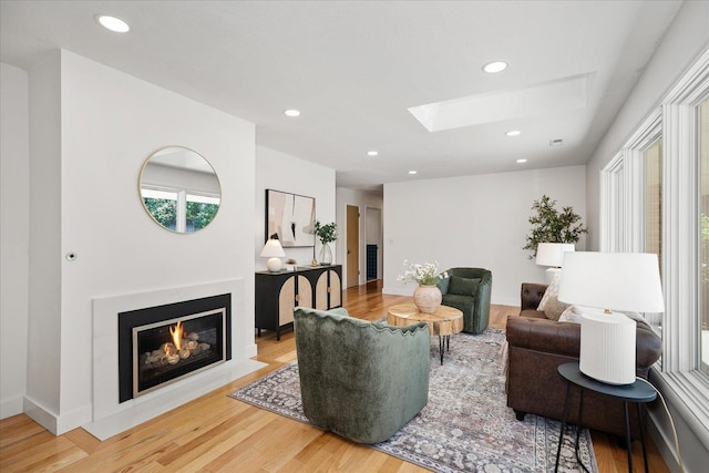 915 W 32nd Ave, Spokane, WA 99203 - living room featuring a skylight, wood finished floors, recessed lighting, and a fireplace with flush hearth