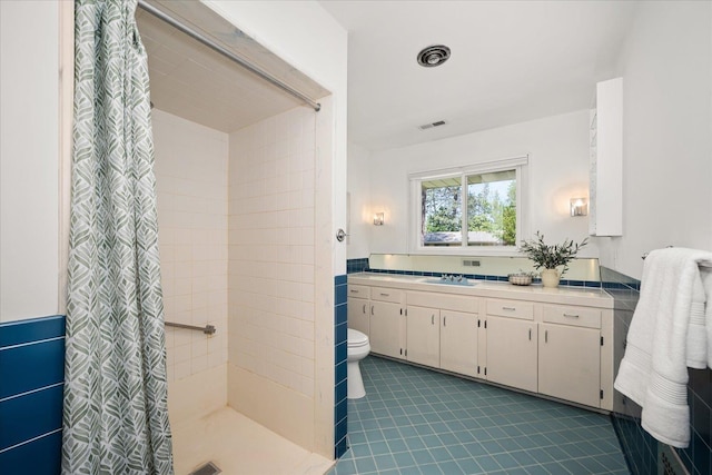 915 W 32nd Ave, Spokane, WA 99203 - full bathroom with a stall shower, vanity, and tile patterned floors