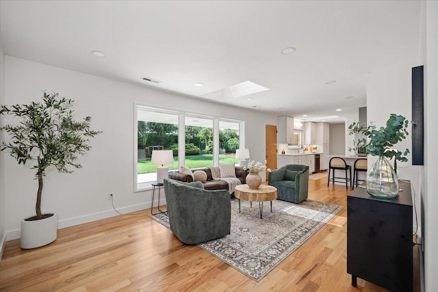 915 W 32nd Ave, Spokane, WA 99203 - living room with a skylight, light wood-style floors, and recessed lighting
