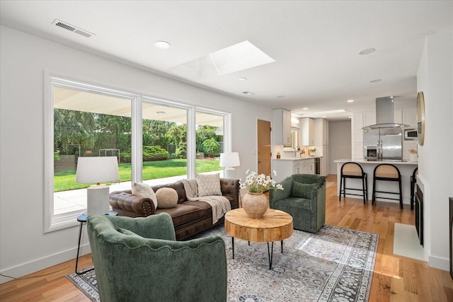 915 W 32nd Ave, Spokane, WA 99203 - living area with a skylight and light wood-type flooring