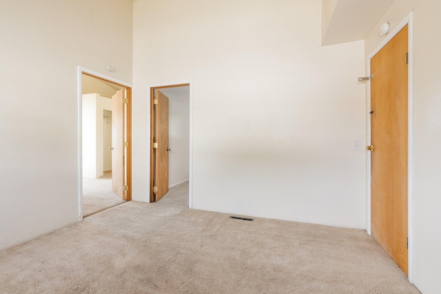 405 W 5th St, Sprague, WA 99204 - unfurnished room featuring light colored carpet and a high ceiling
