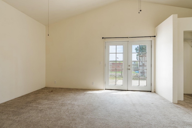 405 W 5th St, Sprague, WA 99204 - spare room featuring carpet flooring, french doors, and lofted ceiling