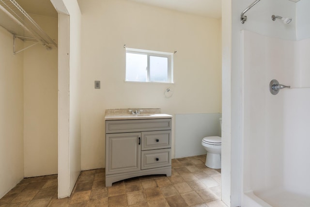 405 W 5th St, Sprague, WA 99204 - bathroom with a shower, vanity, and stone finish floors