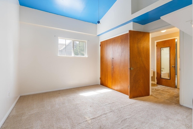 405 W 5th St, Sprague, WA 99204 - unfurnished bedroom with carpet floors, a closet, and a towering ceiling