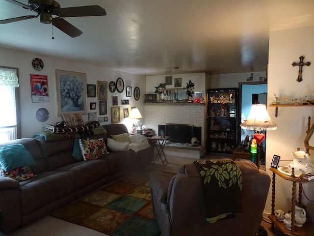 210 W Bartlett St, Oakesdale, WA 99158 - living room featuring a ceiling fan and a brick fireplace