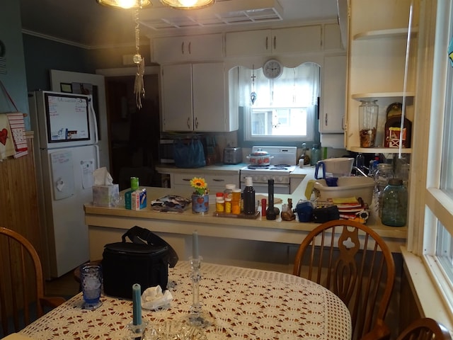 210 W Bartlett St, Oakesdale, WA 99158 - kitchen with white appliances, white cabinets, and light countertops