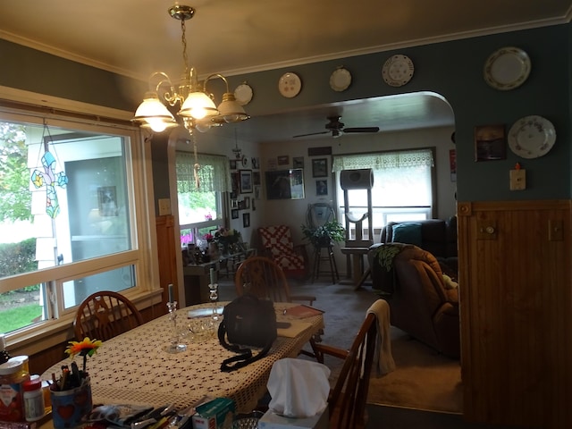210 W Bartlett St, Oakesdale, WA 99158 - carpeted dining area featuring plenty of natural light, ornamental molding, arched walkways, and a ceiling fan
