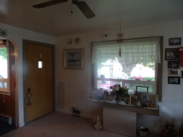 210 W Bartlett St, Oakesdale, WA 99158 - entrance foyer with carpet, a baseboard heating unit, and ceiling fan