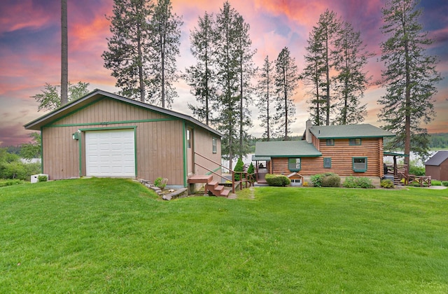 42325 N Sylvan Rd, Elk, WA 99009 - view of front facade featuring a detached garage, a front lawn, an outbuilding, and entry steps