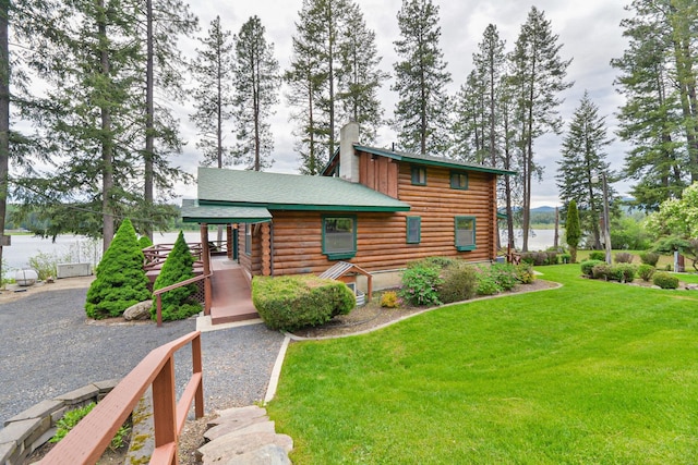 42325 N Sylvan Rd, Elk, WA 99009 - cabin featuring log siding, a front lawn, and a chimney