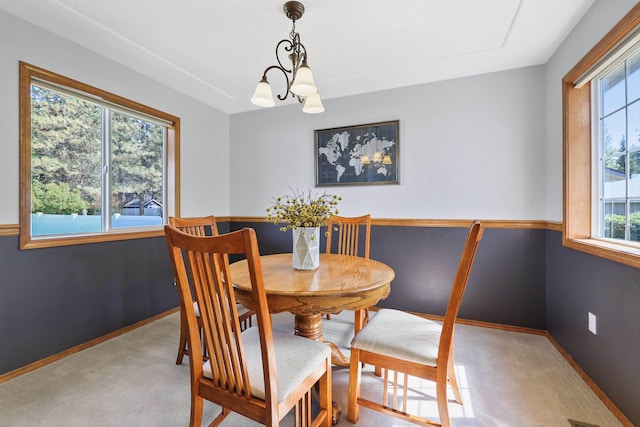 15618 N Chronicle Ct, Mead, WA 99021 - carpeted dining room featuring a chandelier and baseboards