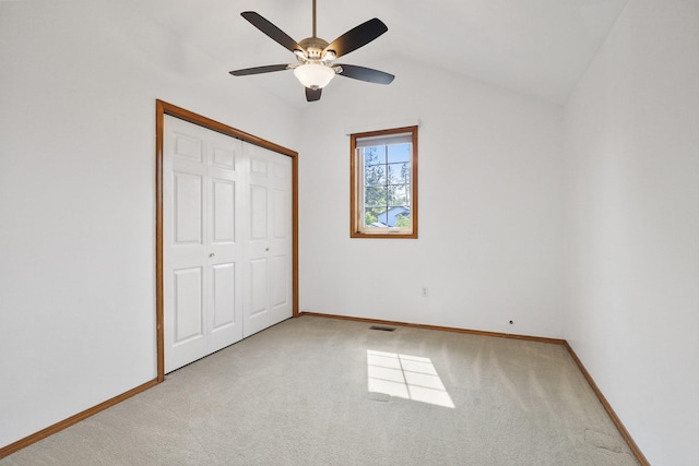 15618 N Chronicle Ct, Mead, WA 99021 - unfurnished bedroom featuring light carpet, vaulted ceiling, a closet, and a ceiling fan