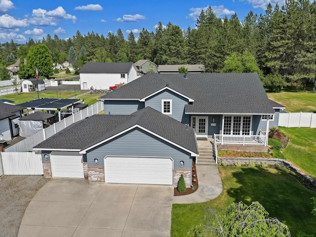 15618 N Chronicle Ct, Mead, WA 99021 - view of front of house with a garage, driveway, brick siding, a shingled roof, and french doors