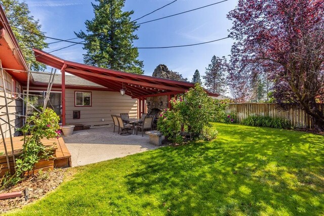 1003 W Eastmont Way, Spokane, WA 99208 - fenced backyard featuring a patio area