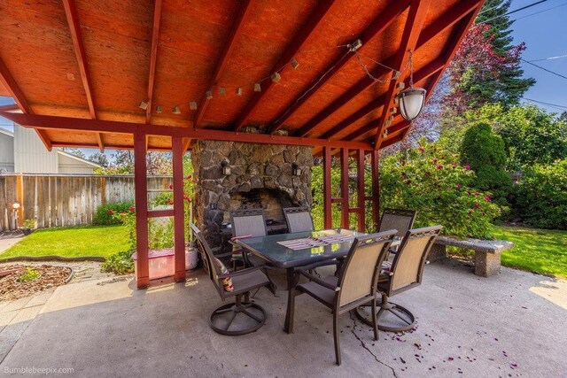 1003 W Eastmont Way, Spokane, WA 99208 - view of patio featuring an outdoor stone fireplace and outdoor dining space