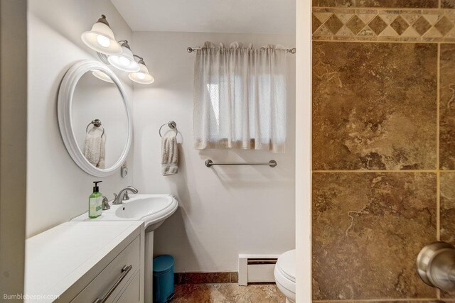1003 W Eastmont Way, Spokane, WA 99208 - bathroom with a baseboard heating unit and vanity
