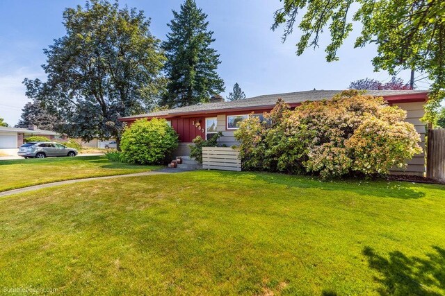 1003 W Eastmont Way, Spokane, WA 99208 - view of front of home with a front lawn and board and batten siding